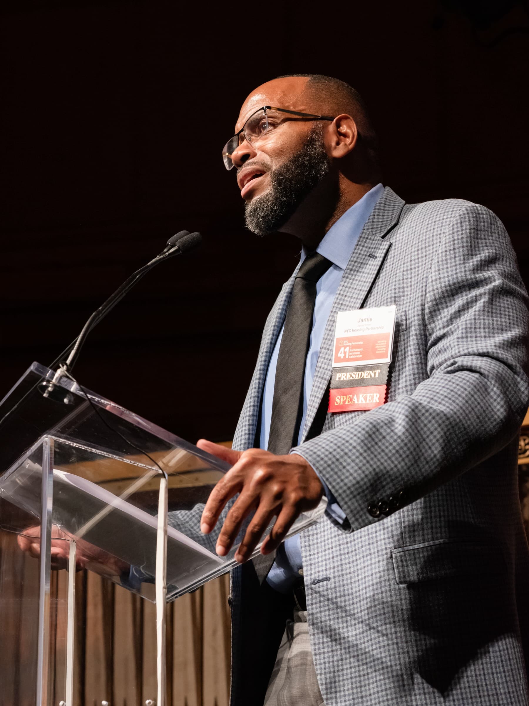 Jamie A. Smarr, Housing Partnership's President & CEO, welcomes supporters at the October luncheon